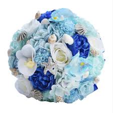 Here's another interesting example of tropical wedding flowers. Wedding Bridal Bouquet Home Beach Seashell Wedding Bouquet Silk Roses Wedding Flowers Holding Tossing Flower Bride Rose Flowers Hydrangea Garden Bouquets Blue Beach Bouquet Starfish Bridal Bouquet Buy Online In Gambia At