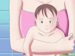 Keep baby happy with distractions. How To Give Your Baby A Bath When Traveling With Pictures