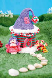 Free knitting pattern for finger puppets inspired by the classic fairy tale including little red riding hood, grandmother, wolf, wood cutter, and a squirrell. Fairy House Free Knitting Pattern Knitting Bee