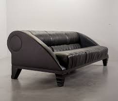 Giorgetti's furniture color palletes are also incorporated in the building's flooring, ceilings and walls. Giorgetti 3 Seat Aries Sofa In Full Black Leather Designed By Leon Krier 134567