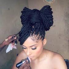 Try to get all of the loose ends of your hair under the hair tie. 23 Exotic Braided Bun Hairstyles For Black Hair