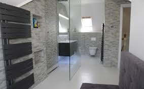 By keeping the walls and the vanity simple and neutral, the designer is able to experiment with the shower and floor tiles and create a load of visual interest with this starburst pattern. Designer Bathrooms Archives Ptc Kitchens