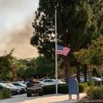 massacre then raging fires: Thousand