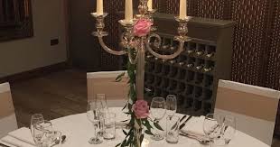 Candelabra With Ruscus And Fresh Roses Candelabra Centrepieceideas Freshflowers Weddingstyling Thefleeceinn Fresh Flowers Centerpieces Wedding Styles