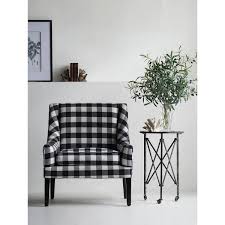 Inside, pair a black and white patterned living room accent chair with a throw pillow or two in solid, bright jewel tones. 32 Black And White Gingham Plaid Arm Chair Overstock 30768039