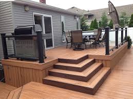 Locate local deck builders for a quote. Trex Transcends Tropics Tiki Torch With Trex Black Glass Railing Modern Deck New York By Stellar Decks Houzz