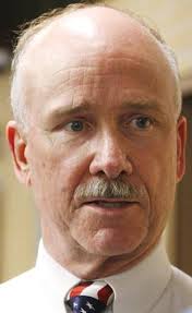 Jenks officials back coach