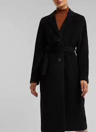 Cappotto lungo sfoderato destrutturato in panno di misto lana e poliestere, modello oversize a doppio petto con revers classici, ampie tasche frontali patch, maniche tre quarti a kimono e ampio spacco posteriore. Saldi Cappotto Lungo In Lana Con Cintura Black Esprit Donna Place Des Tendances