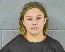 Two arrested, charged after bottle explodes in yard