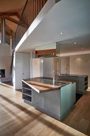 Our latest kitchen design inspired by natural elements. Concrete Kitchen With Concrete Fronts And Sky Blue Wooden Fronts
