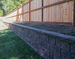 We Set The Fence Back 3 Feet From The Retaining Wall To Create A 3 Foot Planter Bed Our Customer C Backyard Fences Landscaping Along Fence Backyard Landscaping