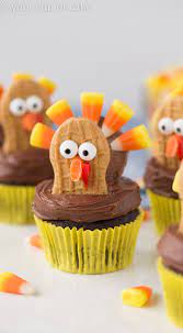 Turkey cupcakes made with hershey kiss faces and reese's pieces feathers! Turkey Cupcakes Thanksgiving Cupcake Decorating Your Cup Of Cake