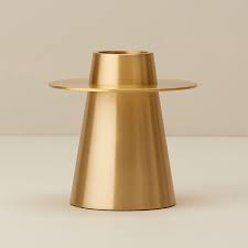 Opt for unscented wax ones in ivory or white, and display them on candle holders of various heights. Oui Small Brass Conical Taper Candle Holder By Oui Gifts Www Chapters Indigo Ca