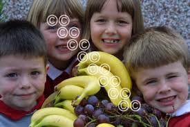 39814682-HARVEST FESTIVAL TIME AT SOUTHDOWN CP, BUCKLEY. Sophie Davies,  Holly Price, Thomas Walker and Ben Dorrington all 6, prepare for their  Harvest festival which is held in the school hall today. -