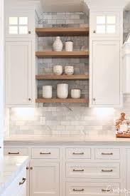 This modern farmhouse kitchen sprawls into one large space that shares sunshine from abundant windows and glass doors and a similar color scheme. Modern European Meets Farmhouse Dream Kitchen