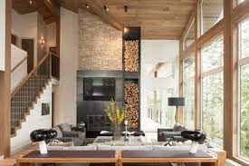 moderner landhausstil umbau almhaus wohnzimmer kamin naturstein brennholz holzdecke fensterf kleine wohnung renovieren wohnung renovieren moderner landhausstil