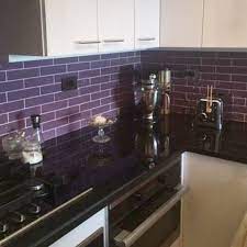 Throughout a weekend or two, you can make a chic and practical backsplash out of the subway. Black Galaxy Granite Kitchen Countertop With Purple Glass Backsplash Tile Countertops Granite Ba Kitchen Countertops Purple Kitchen Purple Kitchen Cabinets
