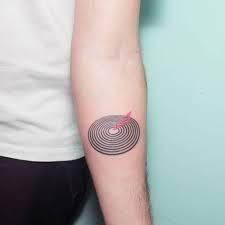 Queen S Jazz Studio Album Cover Inspired Hand Poked Tattoo On The Left Inner Forearm Circular Tattoo Tattoos Queen Tattoo