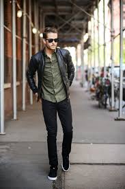 Men S Black Leather Bomber Jacket Olive Long Sleeve Shirt Black Jeans Black And White Low Top Sneakers Black Leather Bomber Jacket Mens Outfits Mens Fashion