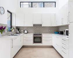 To keep the slick look means stowing things away when they are not in use, including your kitchen cooktop ventilation. This Way The Kitchen Can Get Its Character And Charm Kitchenremodel Kitchendesign Kitche White Modern Kitchen Modern Kitchen Design Kitchen Designs Layout