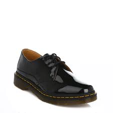 A black pair with a single, leather sole. Dr Martens Womens Black 1461 Derby Shoes Lace Up Patent Leather Smart Docs Ebay