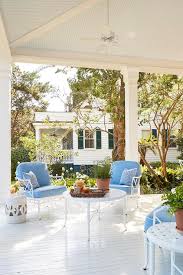 Made from hundreds of reclaimed teak wood pieces, this coffee table is put. White And Blue Outdoor Chairs And White Wrought Iron Coffee Table Cottage Porch Benjamin Moore Simply White