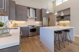 Contemporary Kitchen With Undermount Sink Breakfast Bar Pendant Light Slab Cabinetry L Shaped L Shaped Kitchen Designs Kitchen Design Kitchen Island Design