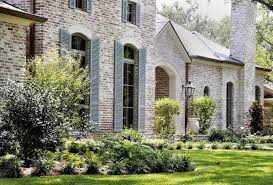 Limewash vs whitewash vs smeared mortar (or mortar wash) vs the worn paint look. Get The Whitewash Look Paint Limewash And The German Smear Becki Owens Brick Exterior House Painted Brick Exteriors Exterior Brick