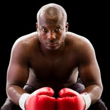 Nicknamed the galveston giant, jack johnson was widely considered to be the most famous african american on the planet for more than a decade as he dominated the world of boxing. Portrait Tough Boy With Black Eye Wearing Boxing Gloves In Fighting Stance Stockphoto