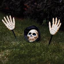 Looking spooky (obviously) putting some light on the ground so people can see where they are walking. Holiday Living Haunted Living Lighted Scary Skeleton Pathway Markers 18 In Set Of 3 Lw19 Kxjea090 Rona