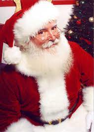 Santa claus near the fireplace and christmas tree with gifts. Santa Claus Wikipedia