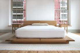 A headboard accommodates several open shelves. Rift Bed Custom Designer Hardwood Platform Bed Frame Semigood Design
