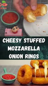 After you have your onion rings all set in place, grab the mozzarella and start stuffing. Cheesy Stuffed Mozzarella Onion Rings Food Food Hacks Health Food