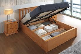 Chester Honey Oak Ottoman Storage Bed Frame 5ft King Size The Oak Bed Store Bed Frame With Storage Ottoman Storage Bed Storage Bed Both of these provide enough space for you to share a bed with your partner, while also allowing you to store your things beneath you without getting in the. chester honey oak ottoman storage bed
