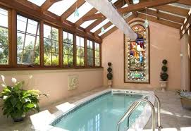 Adding natural light and fresh air from above makes a dramatic difference to any room. Indoor Swimming Pool In A Conservatory With A Stained Glass Window Indoor Pool Small Indoor Pool Glass Pool