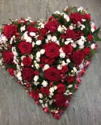 This standing arrangement is artistically created to lend comfort during a difficult time. Red And White Heart Buy Online Or Call 01473 250 076