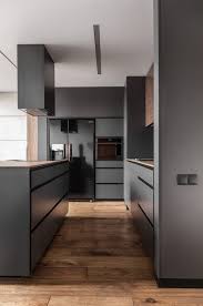 The Kitchen Has A Simple Sober And Masculine Design With Minimalist Lines And Colors Modern Apartment Design Apartment Interior Design Modern Kitchen Design