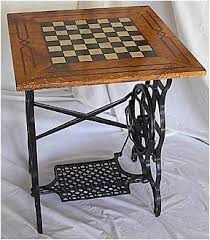 A Table And A Game Board In One Made From An Old Sewing Machine Old Sewing Machines Antique Sewing Machines Sewing Table
