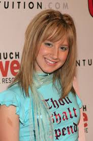 She wears a long straight hair 'do with side parting. Ashley Tisdale S Beauty Evolution Teen Vogue