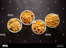 Variety Of Raw Pasta In White Bowls On Brown Textured Background Flat Lay View Stock Photo Alamy