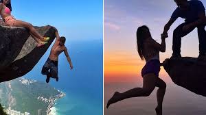 Daredevil couple risk lives for photos as they hang off cliff edge over  3,000ft drop - Mirror Online