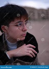 Pensive Transsexual Girl Contemplating the View Looking To the Side Stock  Image