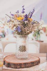 A catchy wedding centerpiece or bouquet of lavender and cotton is a cute and unusual arrangement. Reception Flowers Dried Flowers Wedding Reception Flowers Wedding Flower Arrangements