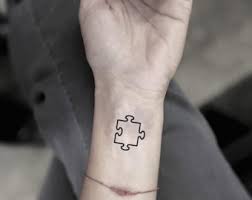 Black and grey puzzle hand tattoo. Qnxd4t1z71cstm