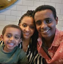 A man takes a selfie using a stick...