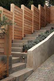 How To Build A Retaining Wall On A Steep Slope Image Result For Retaining Wall Against Fence Building Retai Backyard Fences Privacy Fence Designs Sloped Garden