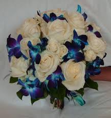 A glam wedding bouquet of white orchids and with a sparkling wrap is a timeless solution for every girl. Blue Orchid And White Rose Brides Bouquet Wedding Flowers Gallery