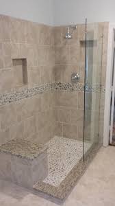 Tiles consist of square pieces of mesh lined with adhered layers of river rocks. Doorless Shower With River Rock Floor Rain Showerhead River Rock Deco Band Creates A Very Therap Half Bathroom Remodel Bathroom Remodel Shower Shower Remodel