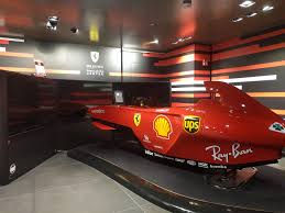 This formula 1 car, the ferrari 641,can withstand lateral forces of up to 4 g on turns. F1 Sim In Ferrari Store Rome Formula1