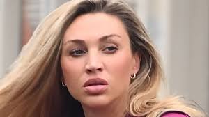 Ryan Giggs' pregnant girlfriend Zara Charles wears a fuchsia tracksuit  co-ord as she stocks up